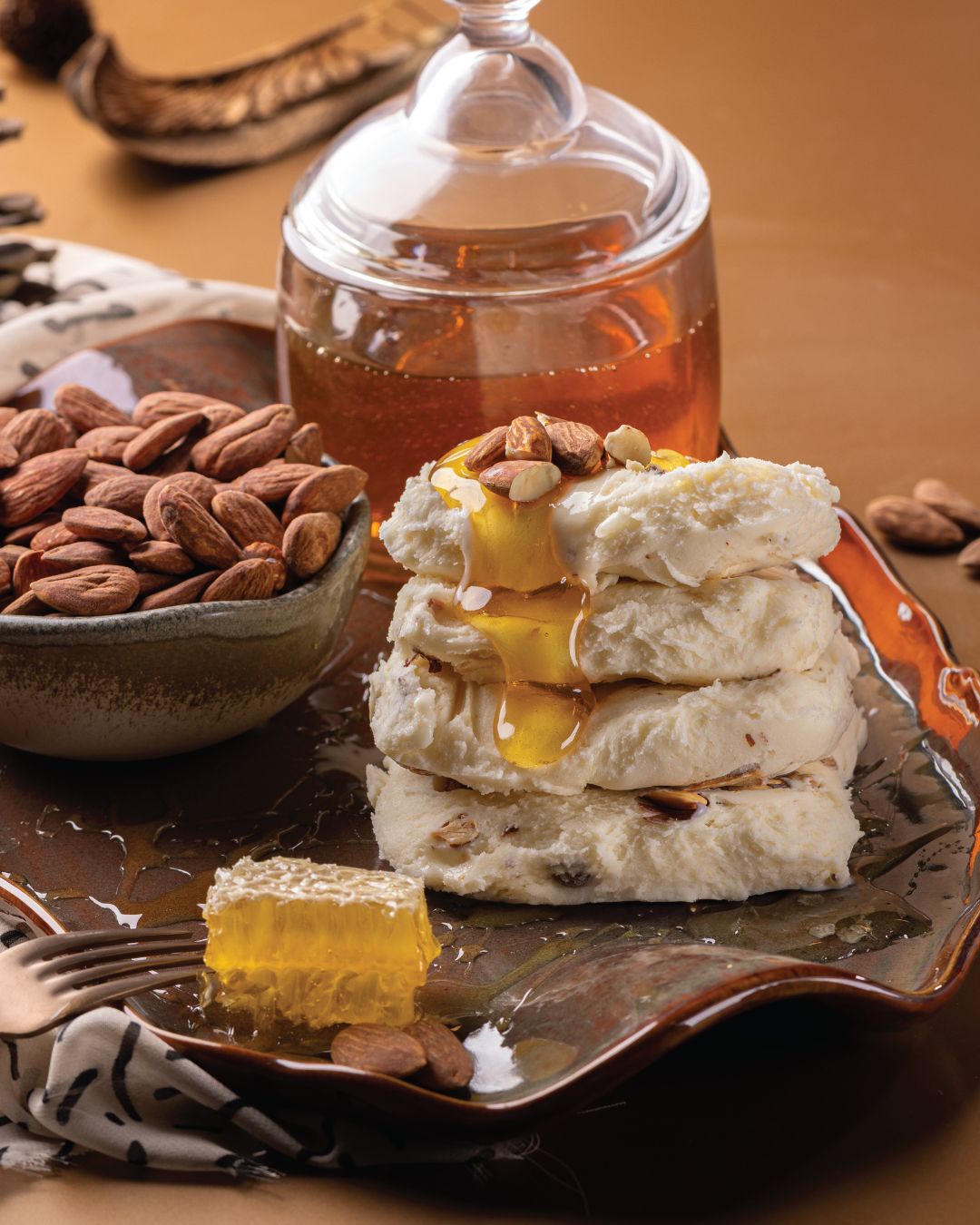 Stacked Maraş dondurma with almonds and honeycomb